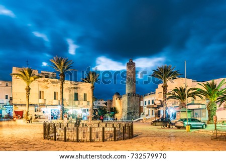 Night photo of street with Ribat castle in Sousse. Medieval architecture in night lights. Vivid picture of ancient religious building - one of the main attractions in Sousse, Tunisia.