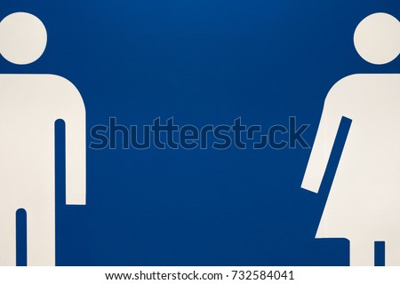 Large Mens and Womens Bathroom Sign on a Wall