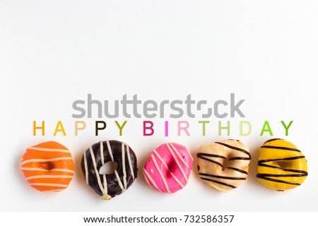 Mixed color donut with candle on clear background, Top view, For Bakery shop Present, Happy birthday  concept.