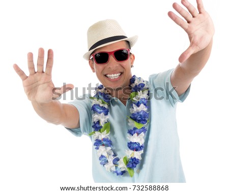 Party boy takes advantage of the carnival spirit. Young latin american man wearing blue shirt. Isolated on white background.
