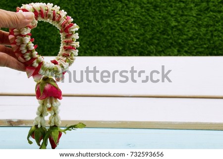 Thai garland is in woman hand