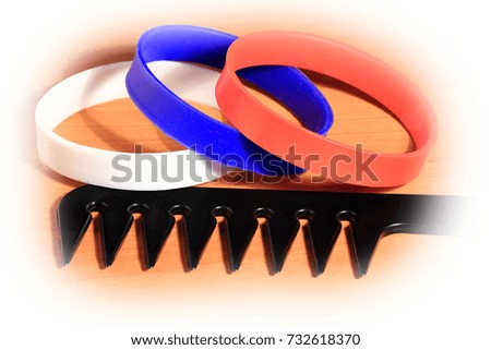 Creative set of Black Hair Comb on Wood Background with white tune.