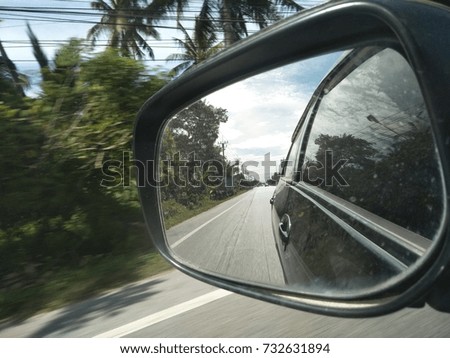 picture reflect to car and sky view behind, selective focus at picture in mirror