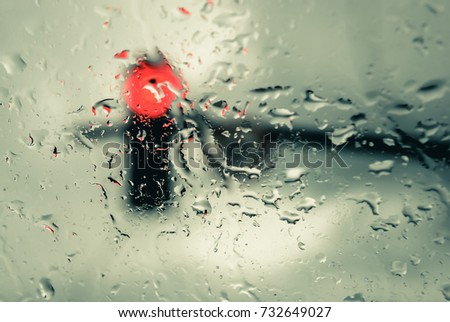 Traffic light in the rain