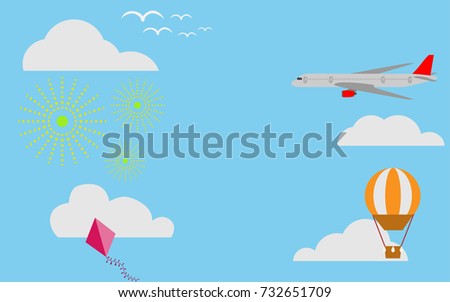View of sky with airplane, kite, orange hot air balloon and fireworks with cloud in the blue sky