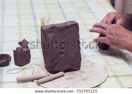 A piece of clay for modeling on the table