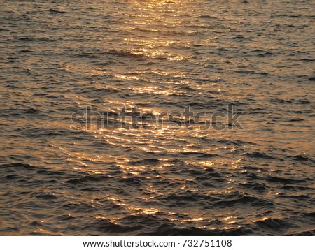 Sunset water background, picture of the surface water in the sunset time, Natural beautiful thing.