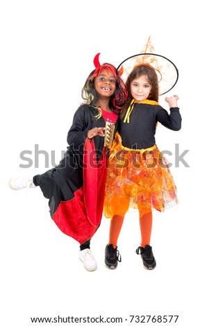 Girls with face-paint and Halloween costumes over a white background