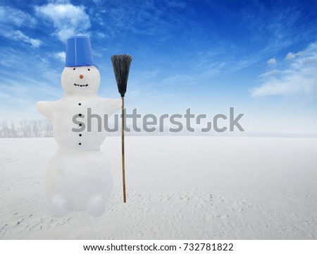 Snowman standing in winter landscape