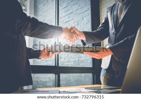 Business partnership meeting concept. Image businessmans handshake. Successful businessmen handshaking after good deal. Group support concept. Royalty-Free Stock Photo #732796315