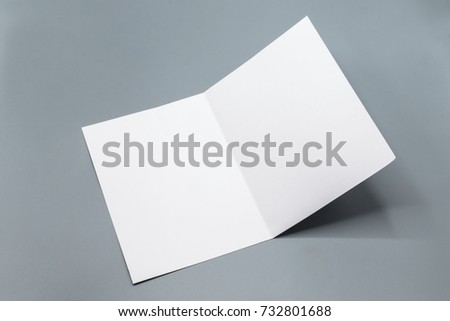 Mockup empty white paper brochure for Advertisements on gray background