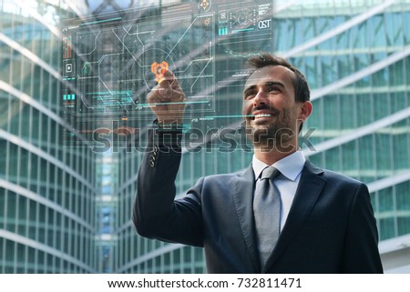 A businessman with holography controls the gps location on futuristic maps and looks at the way to go. Concept of: travel, future, increased reality, businessman