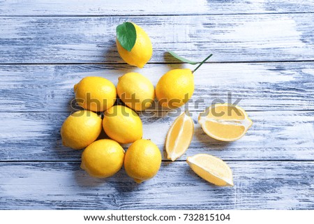 Fresh lemons on wooden background