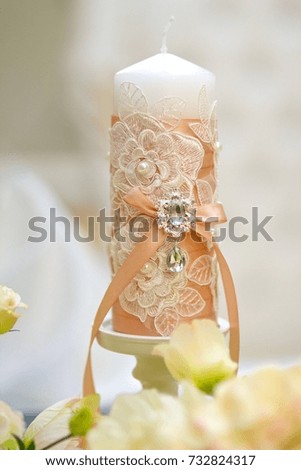 Decorated candle for wedding celebration