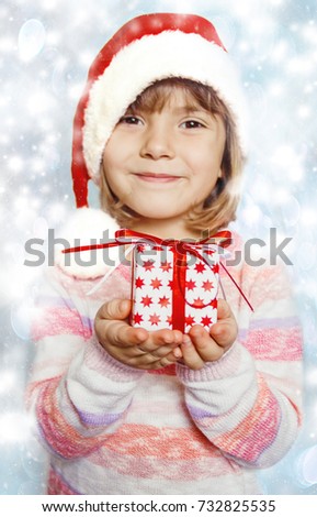 child with gift in hands. Selective focus.