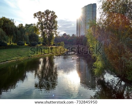 very beautiful picture of water, nature and buildings
