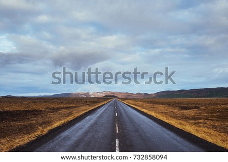 Asphalt road to the mountains Iceland. Beauty world.