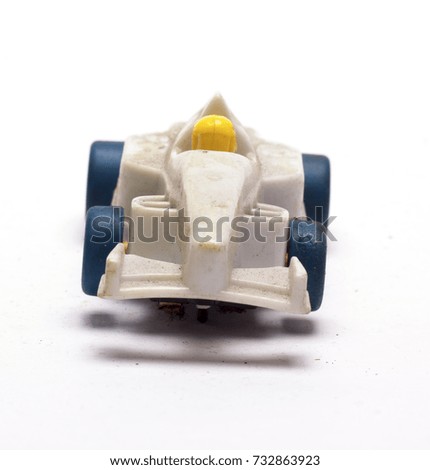 old children's racing car on a white background/old race car/isolated objects