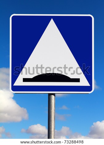 Speed bump (sleeping policeman) traffic sign on a sky background