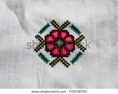 Embroidered old handmade cross-stitch ethnic Ukrainian pattern. Seamless ornament