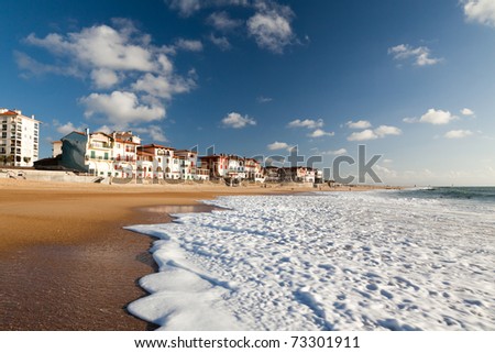 A large white water wave sliding on the Hossegor beach - France Royalty-Free Stock Photo #73301911