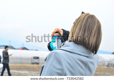 Women with photography activities.