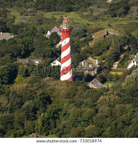 Aerial view of the red and white lighthouse (Westerlichttoren) of the village of Burgh Haamstede on the island of Schouwen-Duiveland in the province of Zeeland, Holland.