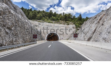 Tunnel through the mountain on the highway.