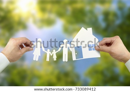 Hand hold house and family Royalty-Free Stock Photo #733089412