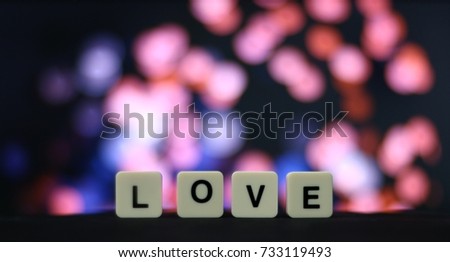 Wording of ‘LOVE’ With colorful bokeh background.