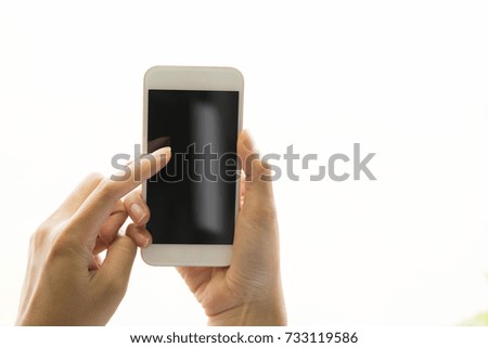 Hand touch phone isolated with clipping path on isolated white. And mock-up with shadow smart phone