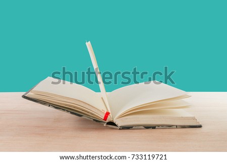 open book old on wooden floor isolated on blue background with copy space add text  ( high definition image )