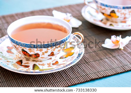 Tea on bamboo blue board background