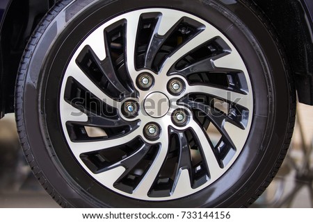 Close-up of aluminium rim Detail background,Car rim, alloy wheels Royalty-Free Stock Photo #733144156