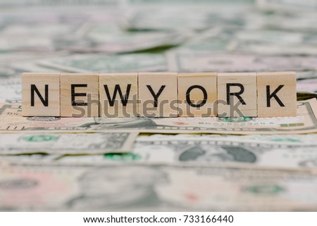 the word "New York" written in wooden block letters
