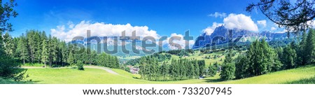 Beautiful panoramic view of mountains and meadows, Italian Alps in summer season.