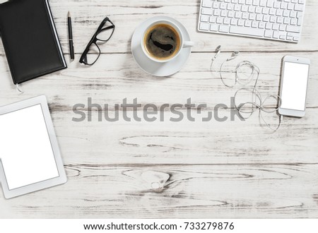 Office desk with tablet pc, notebook, mobile, cup of coffee. Business background with space for your text image picture. Flat lay 