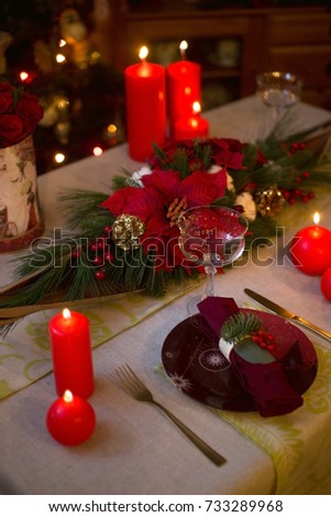 Festive composition with fir branches and flowers on the table