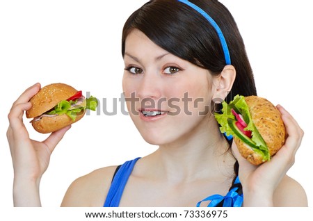 Young woman eating sandwich, isolated on white background