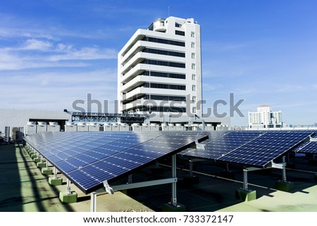 A blur picture of solar panel installed on the building in the city.