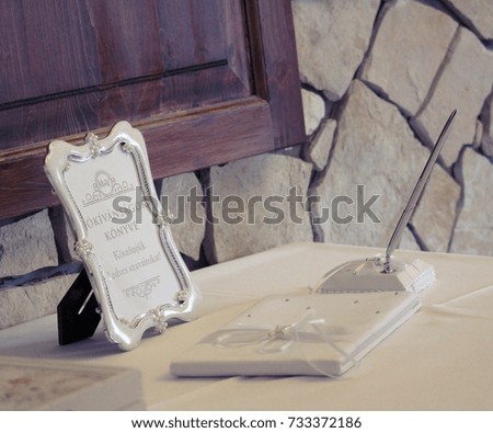 Beautiful Wedding Decoration on the table with a picture frame with Hungarian text, which means: 
"The Book of Greetings, Thank you for your nice words"