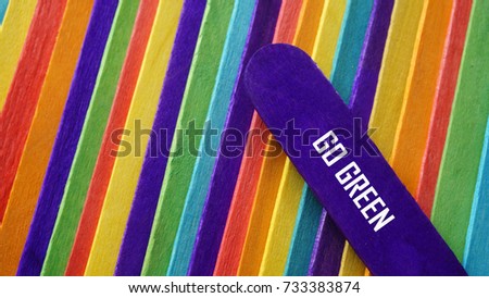 Concept colorful ice cream stick with word GO GREEN