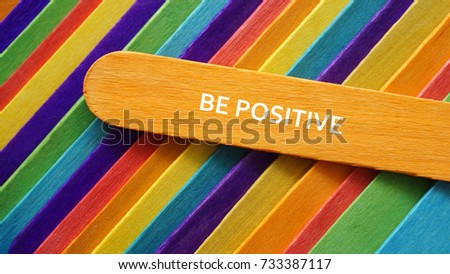 Concept colorful ice cream stick with word BE POSITIVE