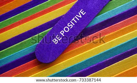 Concept colorful ice cream stick with word BE POSITIVE
