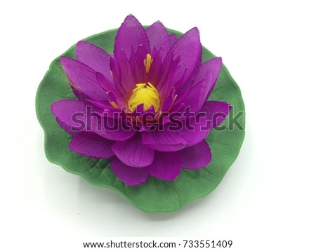 Purple lotus artificial flower on white background