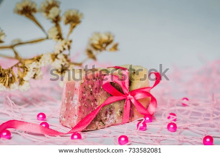 Pink bow on soap Royalty-Free Stock Photo #733582081