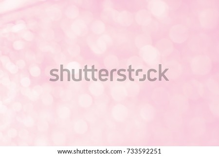 Abstract blurred and bokeh of thinly droplets and reflection lighting on pink background. 