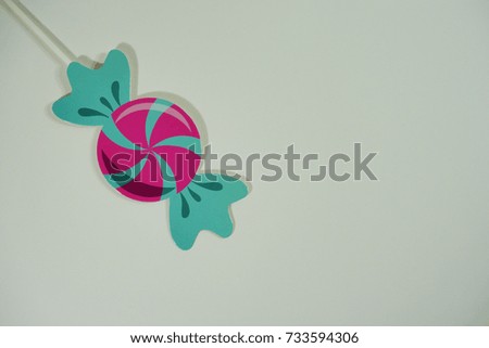 Top or flat lay view of birthday props, colorful candy on isolated white background. Birthday parties text and props.