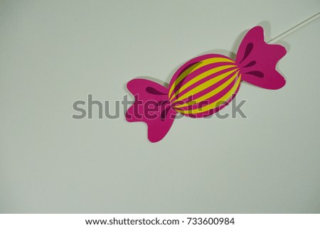 Top or flat lay view of birthday props, colorful candy on isolated white background. Birthday parties text and props.