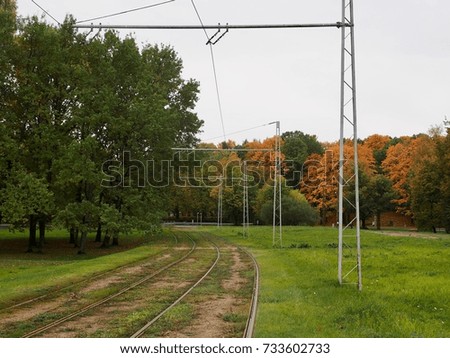 Autumn landscape with tram rails near city park in Latvia in Europe.